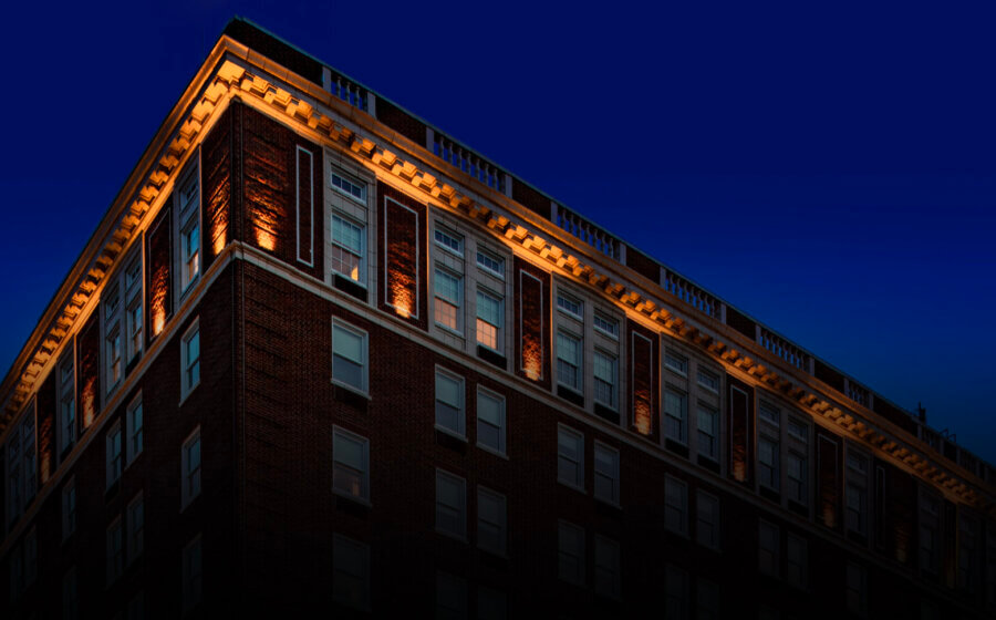 The Yorktowne hotel from the outside at dusk with all the lights of the hotel shining.