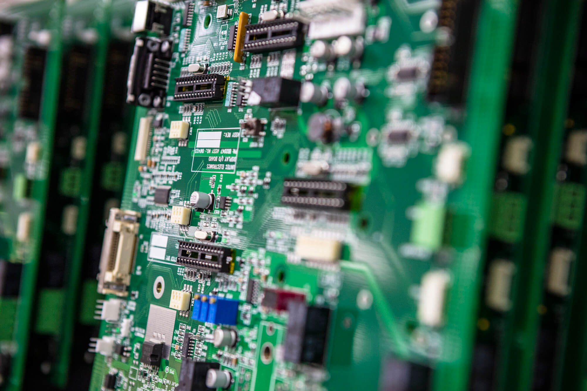 A close up shot of a green circuit board.