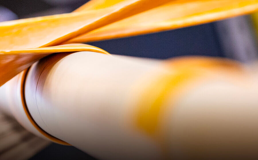 Close up shot of a roll of cardboard being made.