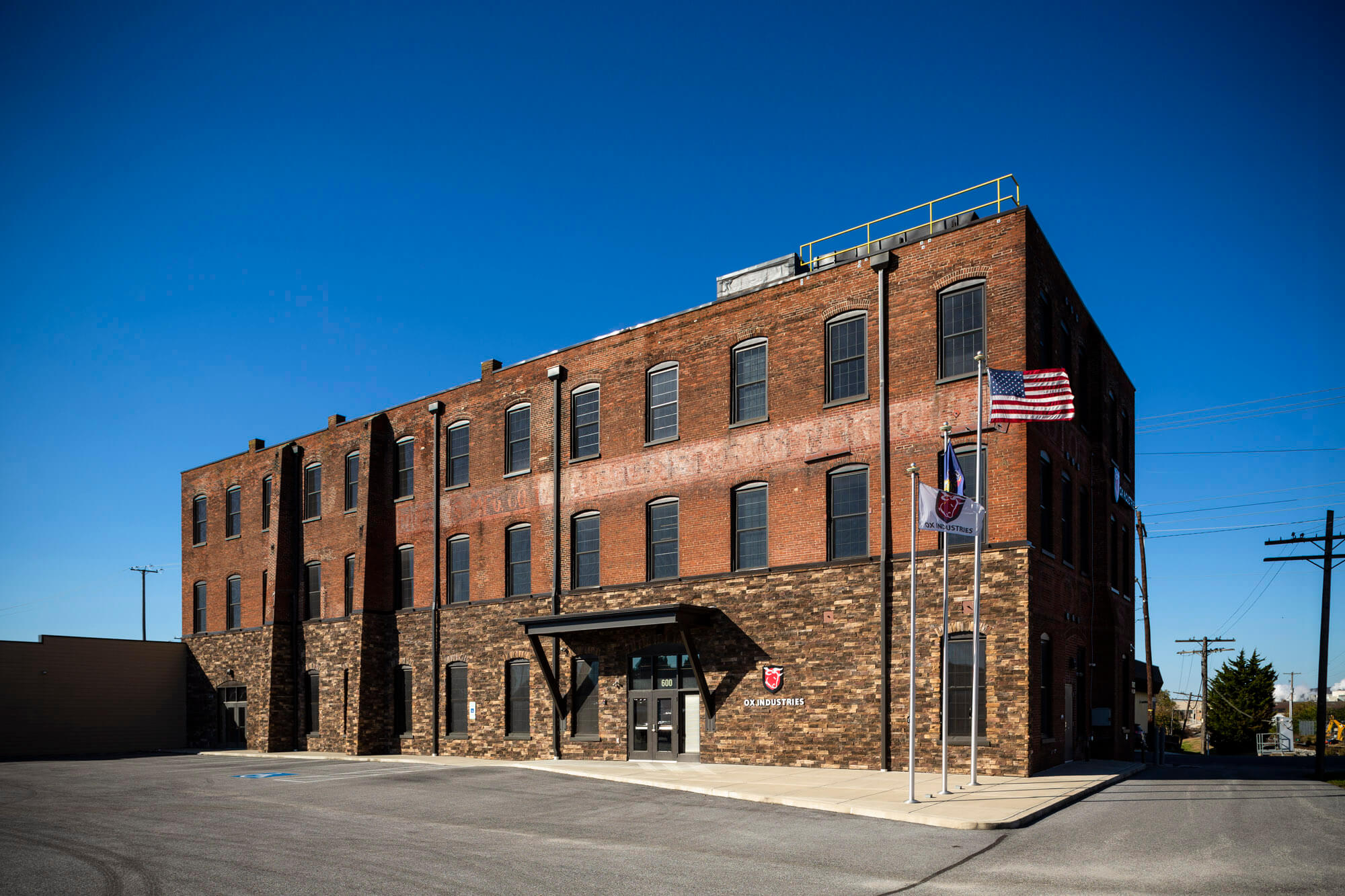 An outside shot of a three level factory building.