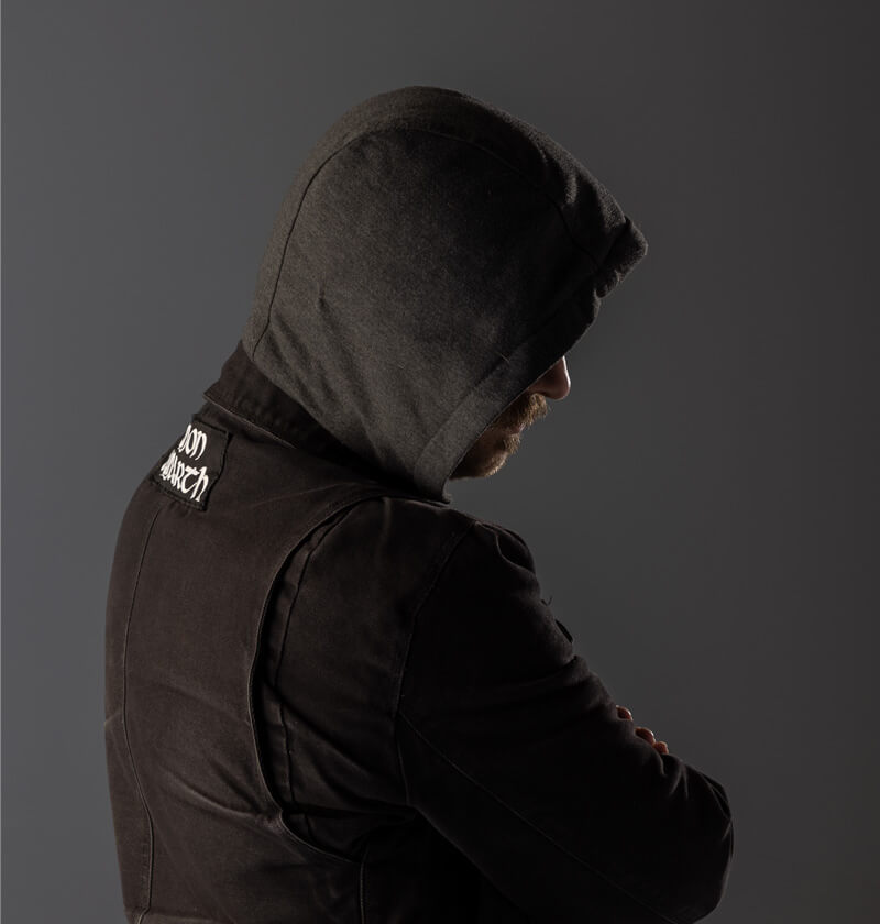 Person in a hood with the hood up and facing away from the camera