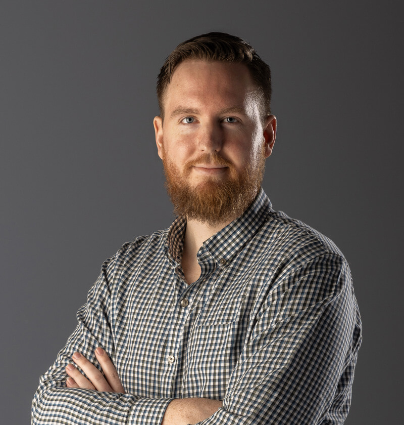 Man looking at the camera with a checked shirt