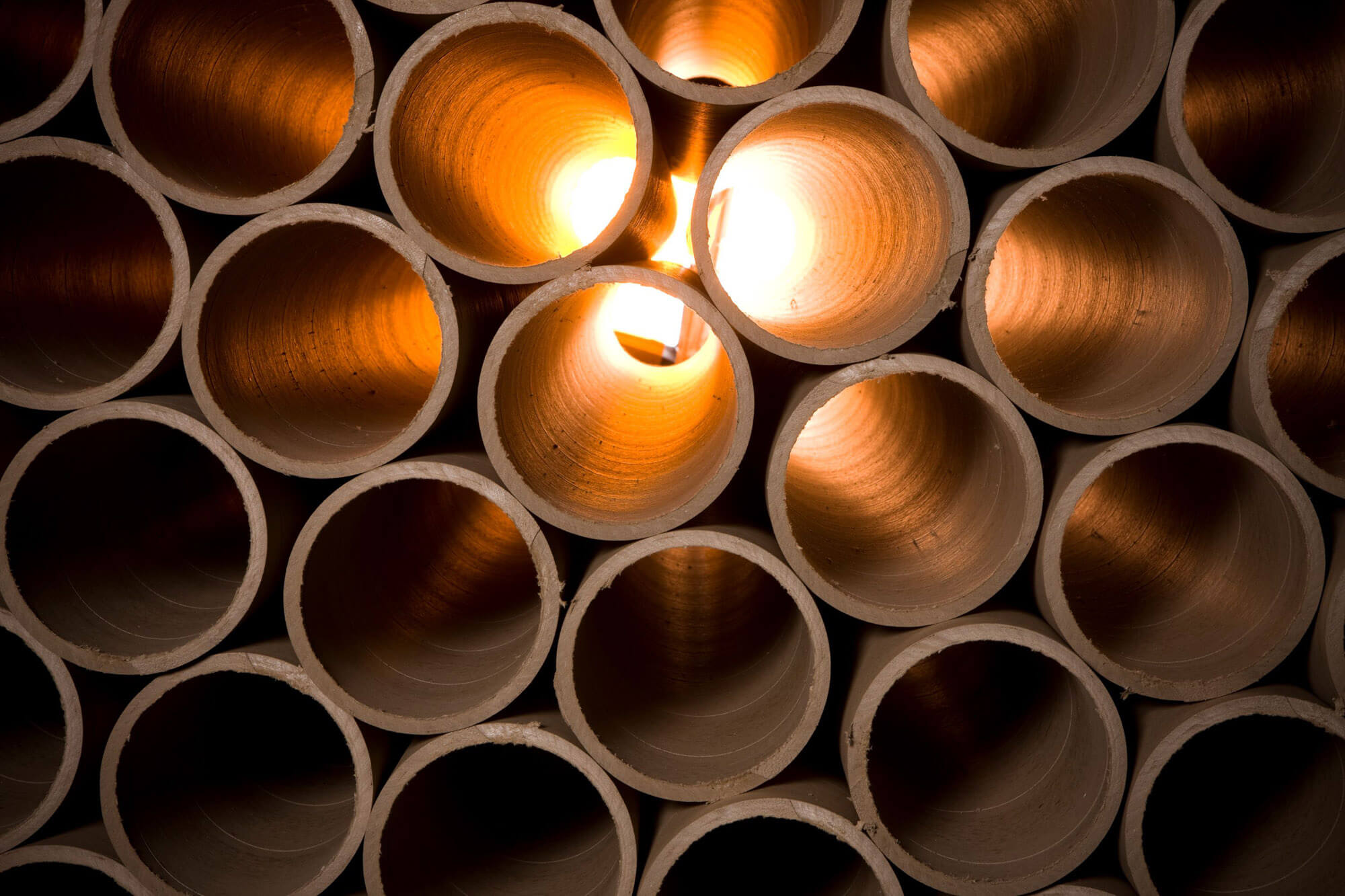 A stack of tubes and the camera is looking through the tubes with are backlit.