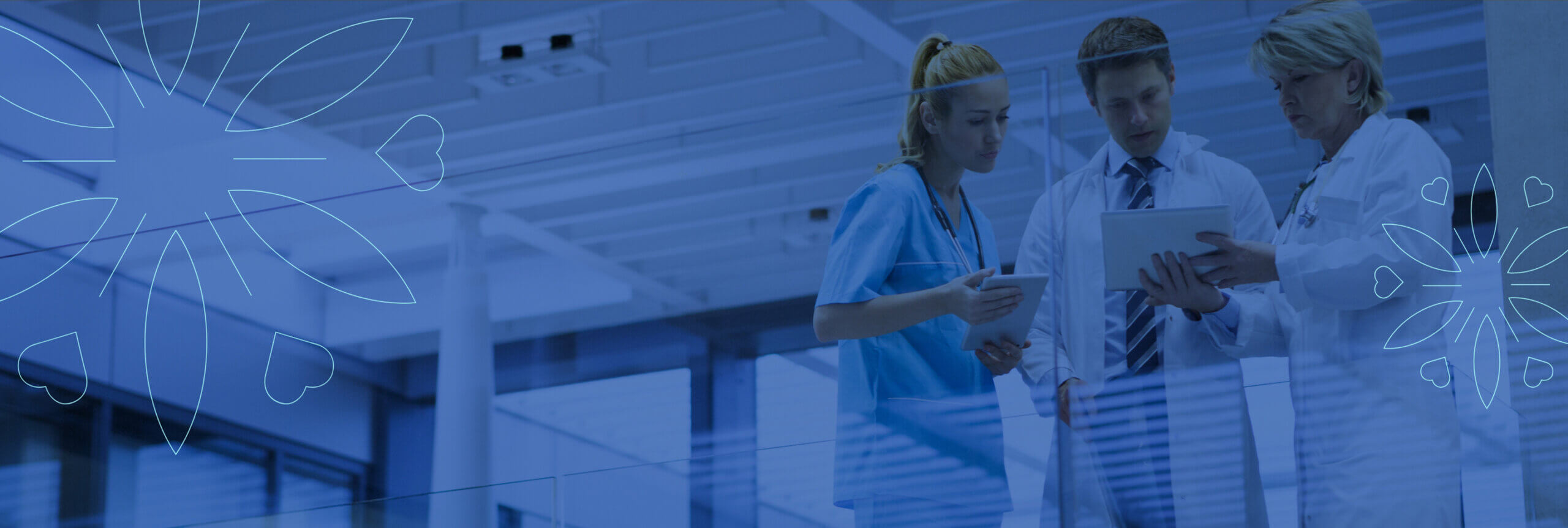 Three medical staff looking at a report.