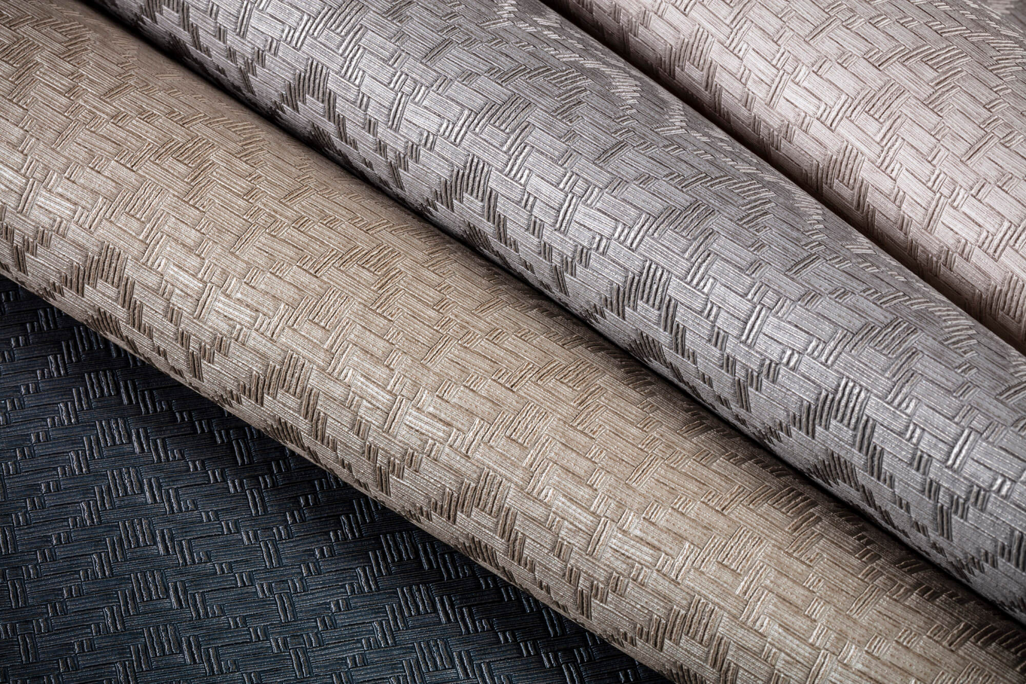 A close up of four different textured wall paper designs.