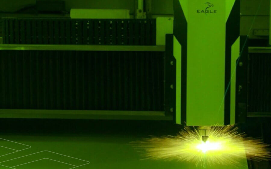 A laser cutting a piece of metal and sparks going out everywhere.