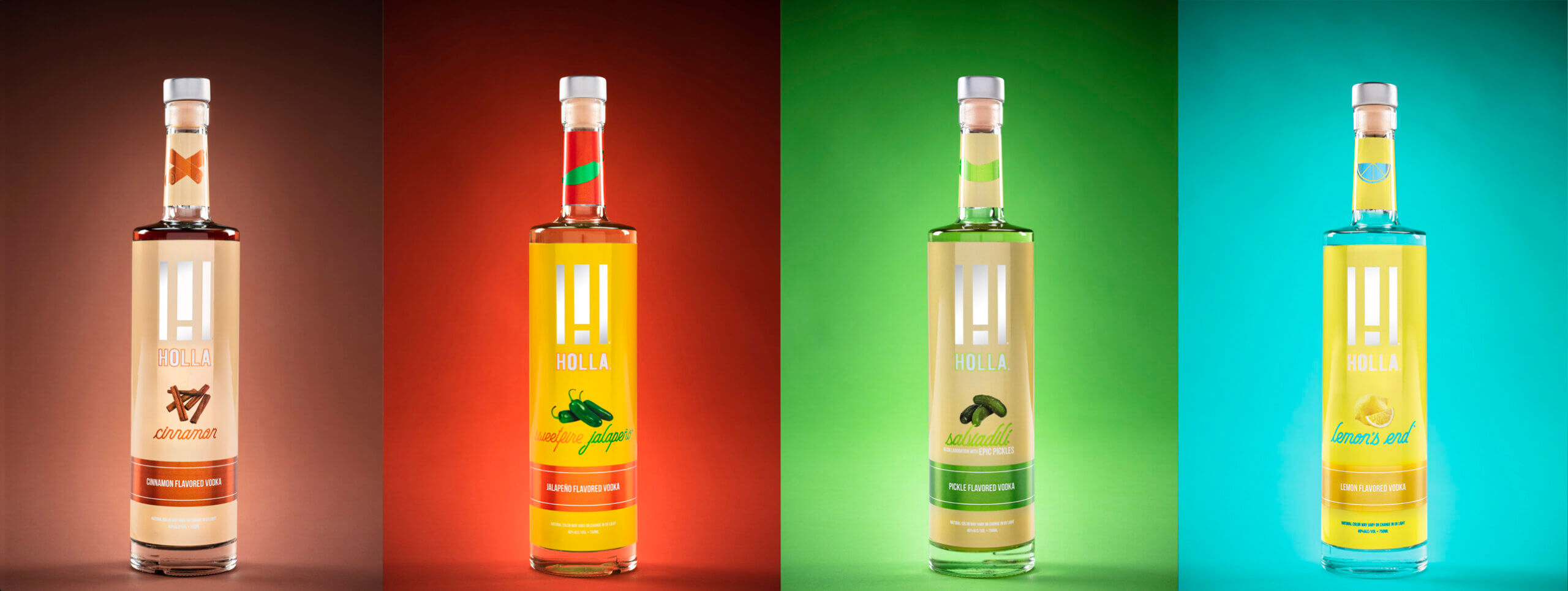 Four bottles of Holla vodka with different flavors.