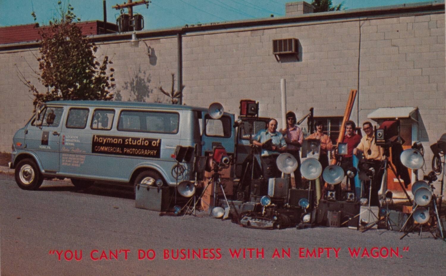 An old photo from the 1970s with the Hayman van and all the camera equipment and staff at the back of the van.